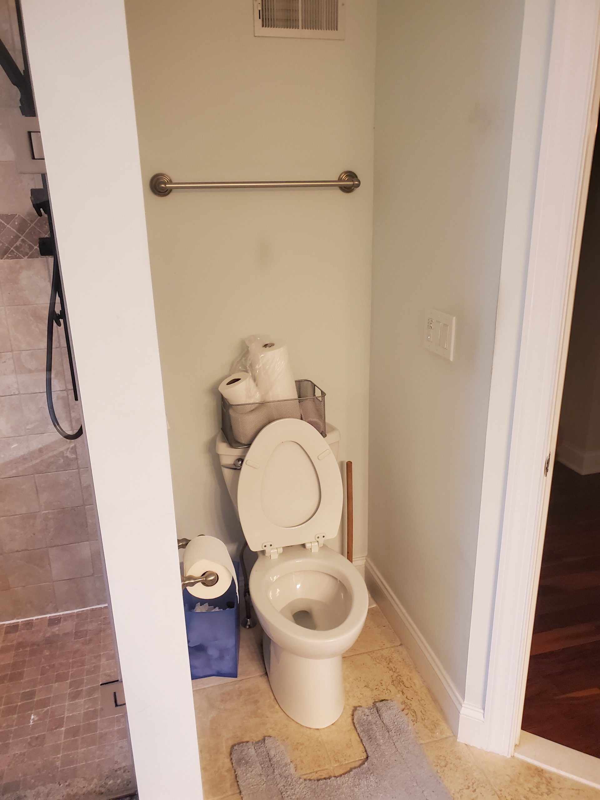 Small half bath before renovation with beige tile floor