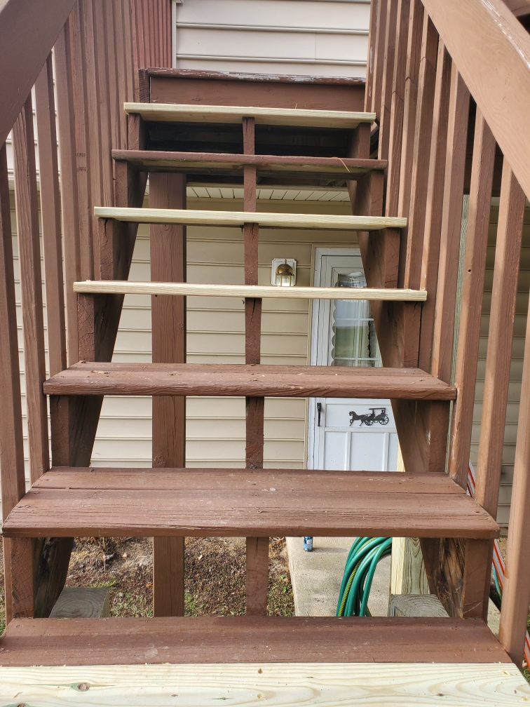 Rebuilt wood deck stairs with new stringers and treads