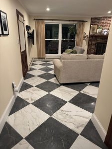 Black-and-white checkerboard marble tile floor in a living room