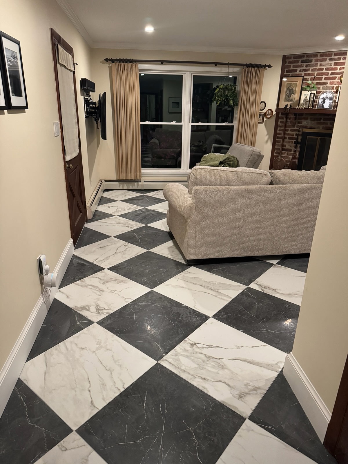 Black-and-white checkerboard marble tile floor in a living room